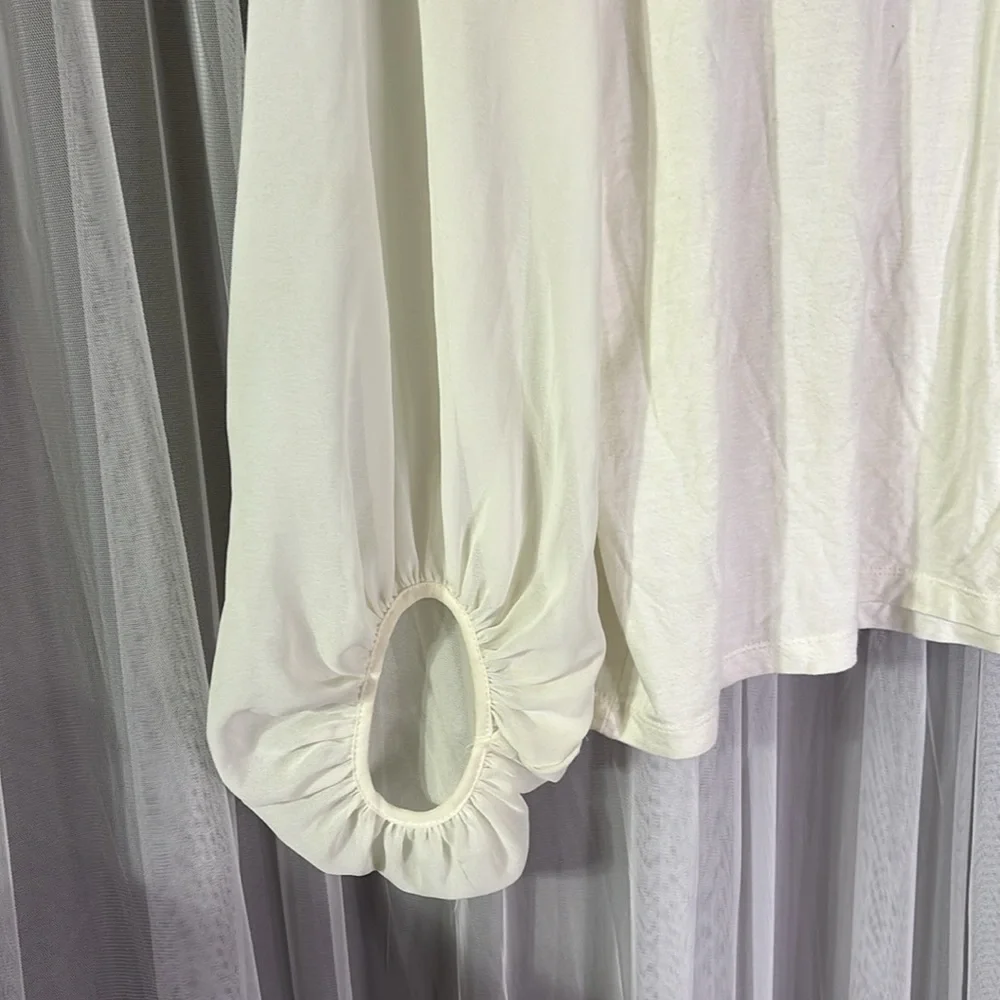 Stretchy cream sheer sleeves blouse! Tie back with key hole!